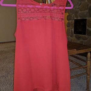 Red sleeveless blouse